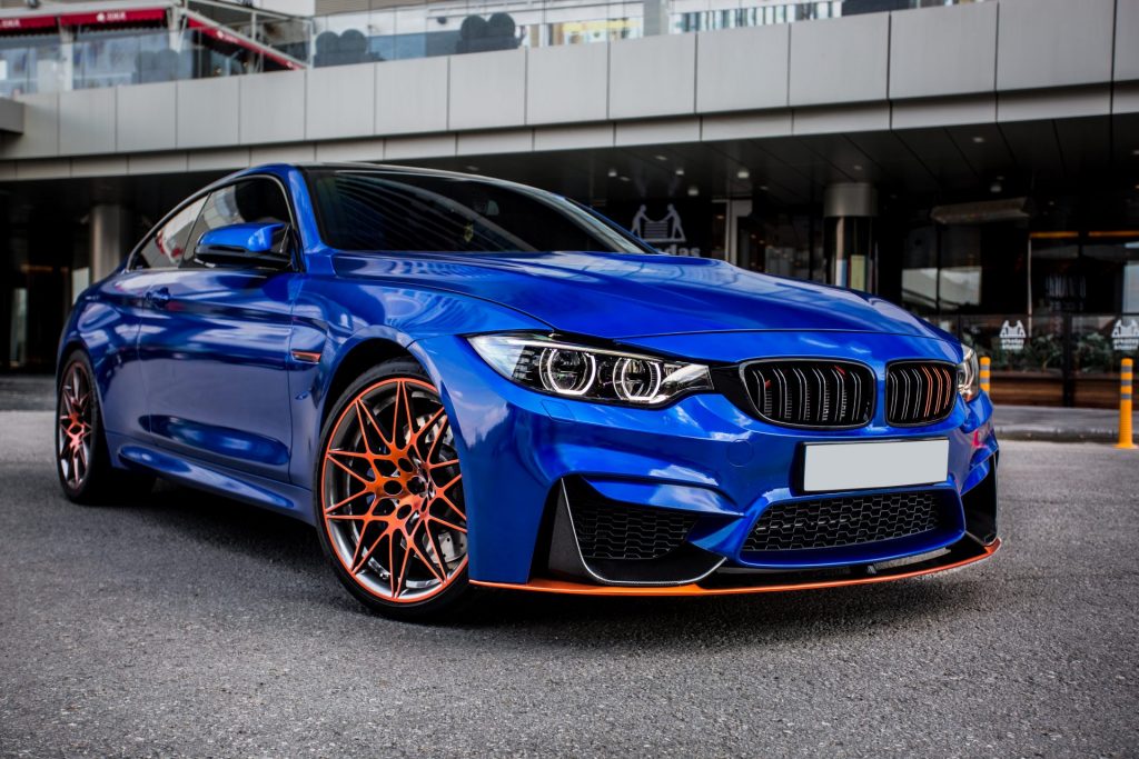 blue-sport-sedan-parked-in-the-yard